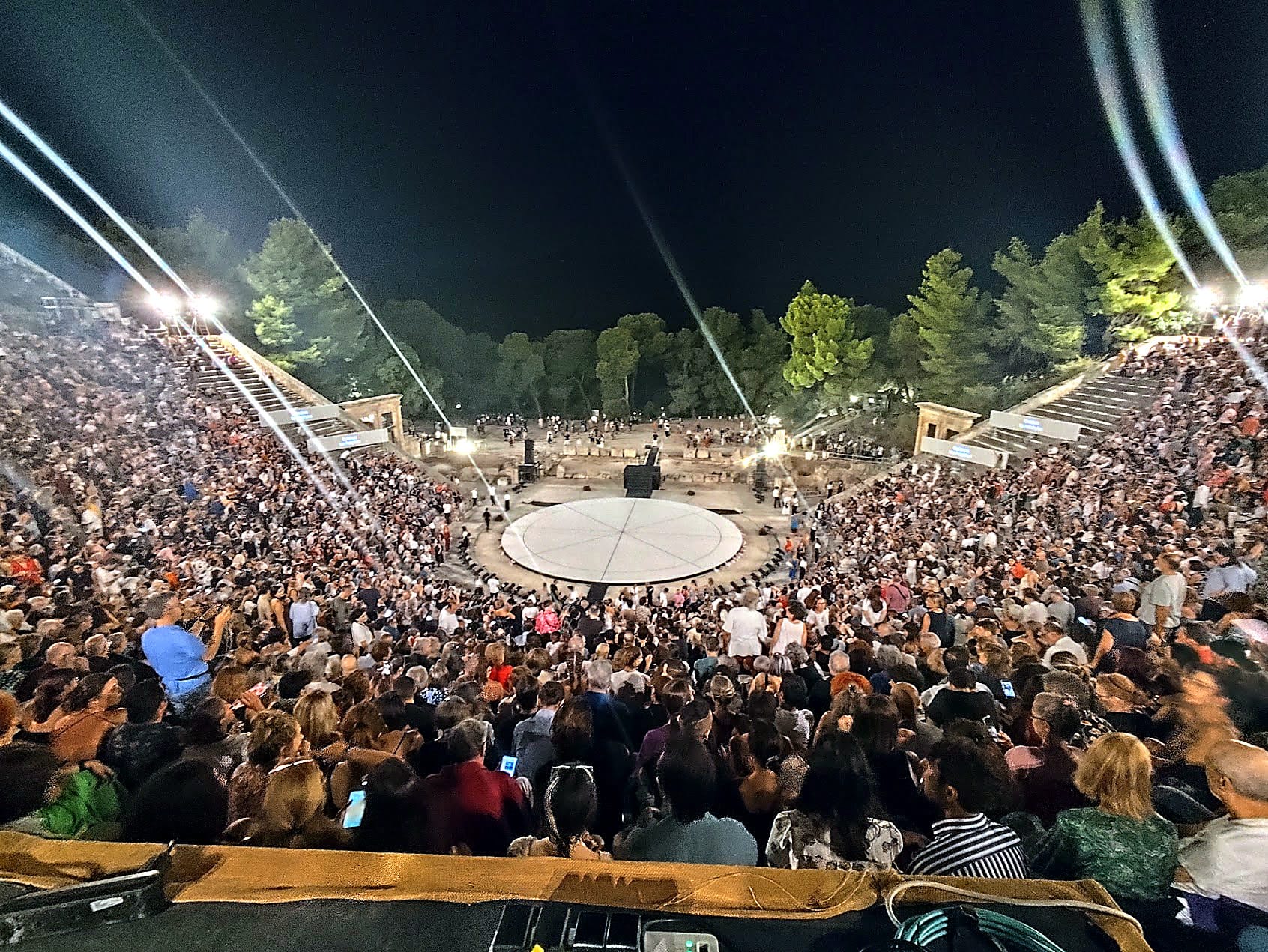Ancient Theatre of Epidaurus at night, audience and surtitle screens