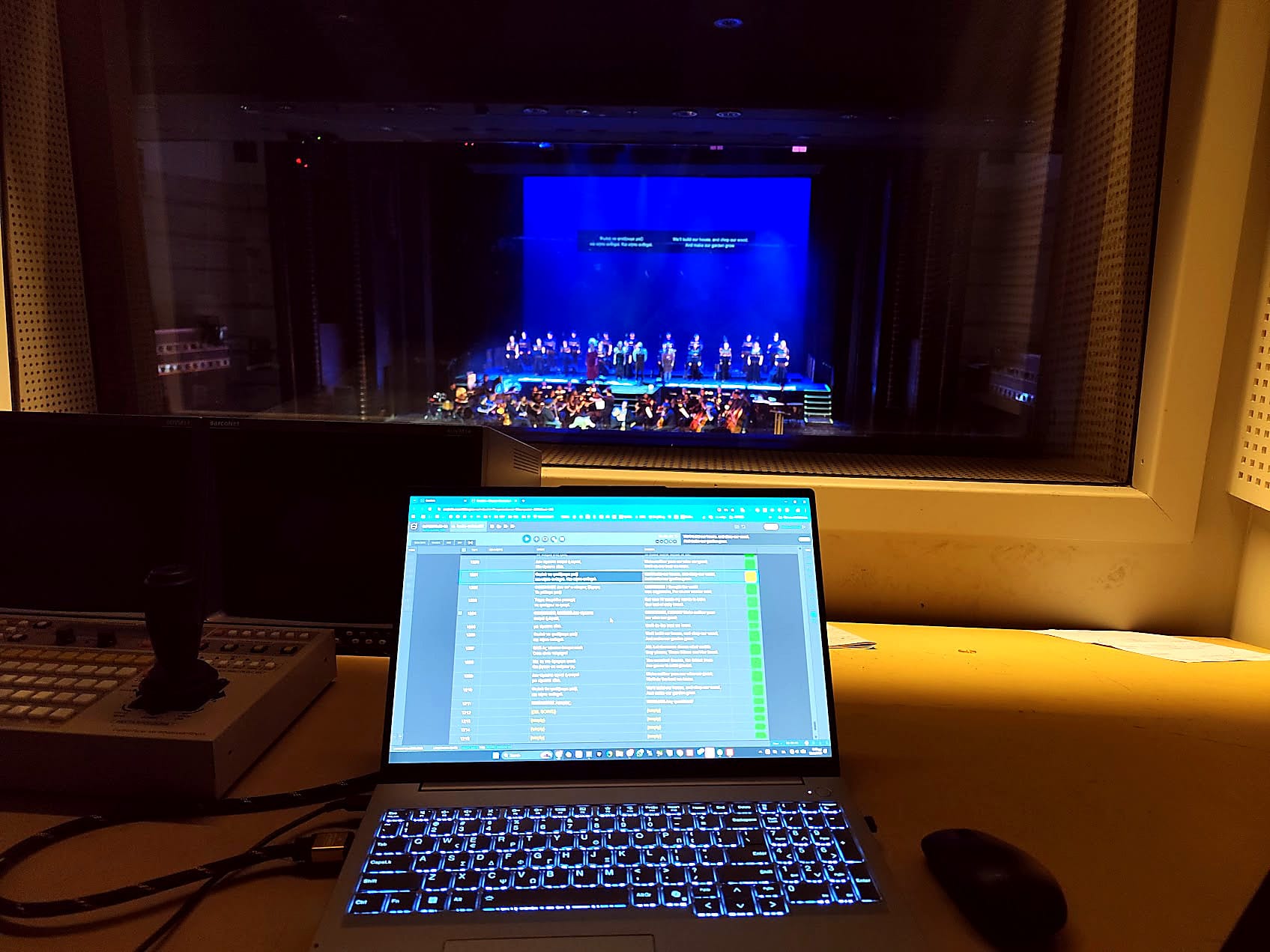 SuperTitles live editor in the operator booth at Megaron, titles on stage